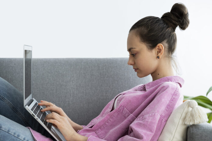 side-view-woman-working-laptop